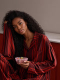Haitang crimson stripe pajama set seated lifestyle
