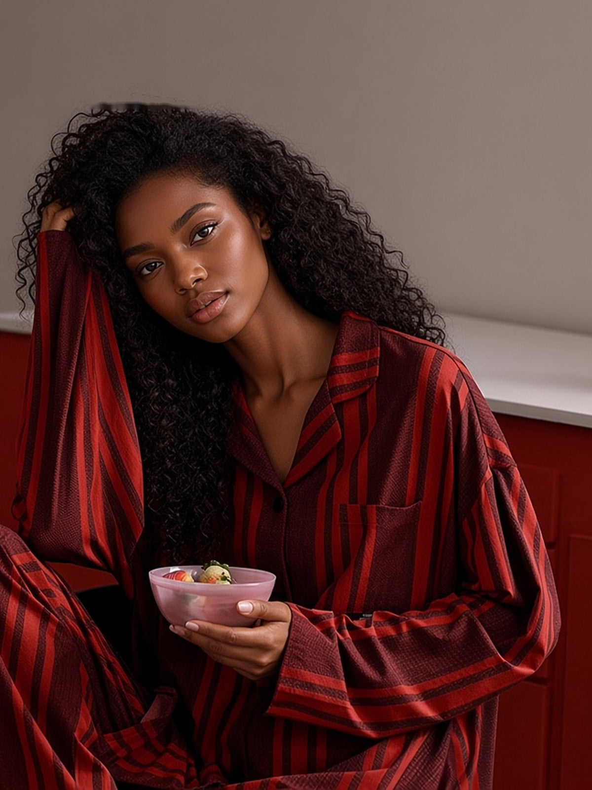 Haitang crimson stripe pajama set seated lifestyle