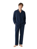 Young Caucasian man Ink Navy Stripe white studio barefoot