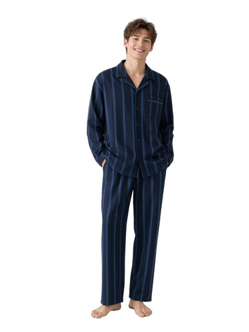 Young Caucasian man Ink Navy Stripe white studio barefoot