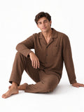 Cocoa Palm editorial seated floor barefoot white studio check garment